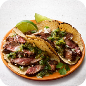 Carne Asada Flap Steak Tacos with Salsa Verde, Cotija Cheese & Lime